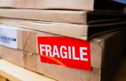 Closed cardboard box with fragile sticker